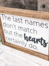 Load image into Gallery viewer, The  Last Names Don’t Match But The Hearts Certainly Do Framed Sign - Gift
