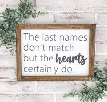 Load image into Gallery viewer, The  Last Names Don’t Match But The Hearts Certainly Do Framed Sign - Gift
